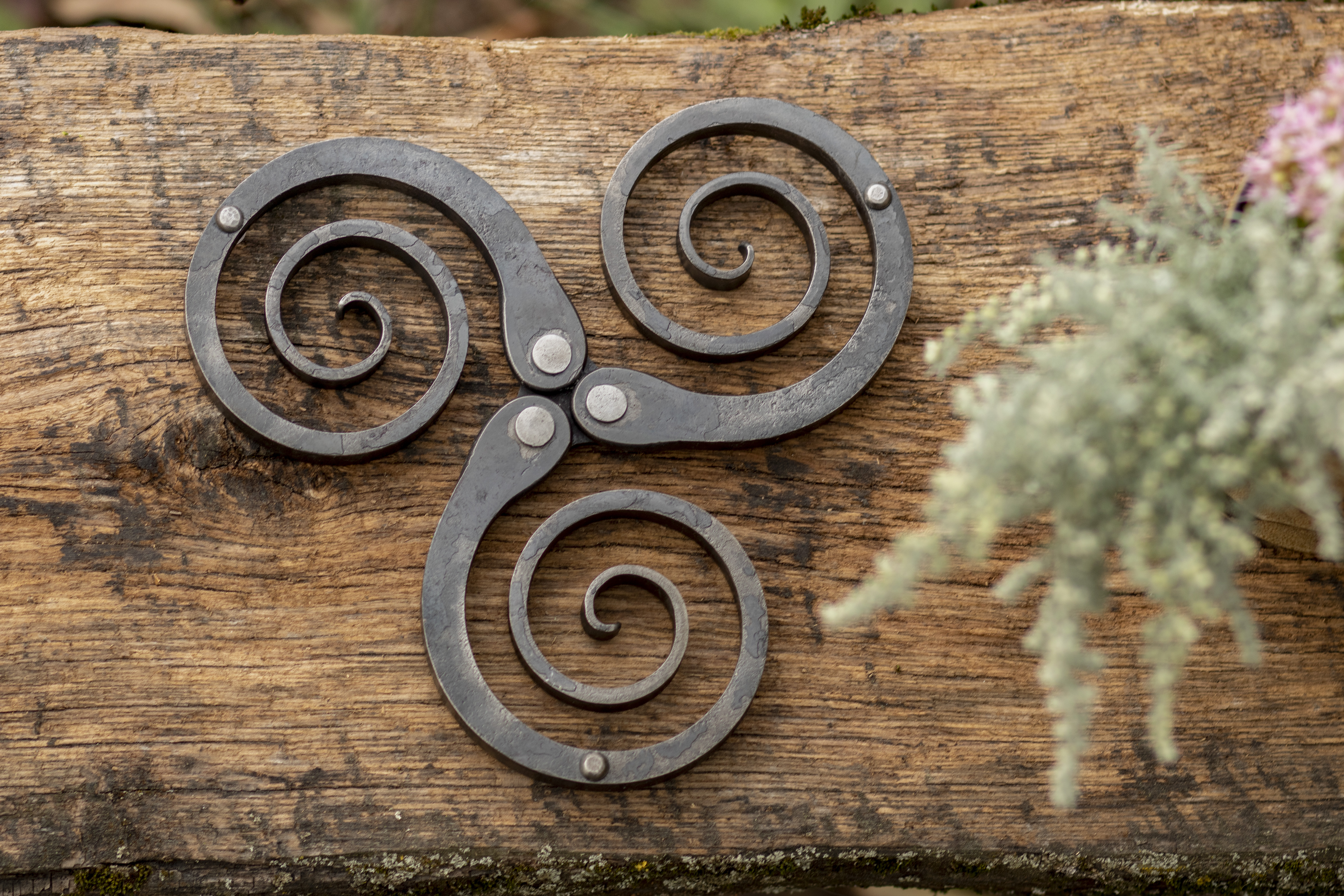 Rustic wrought iron trivet - hand forged metal pot holder and table decor featuring a Celtic triskelion design, photo 5