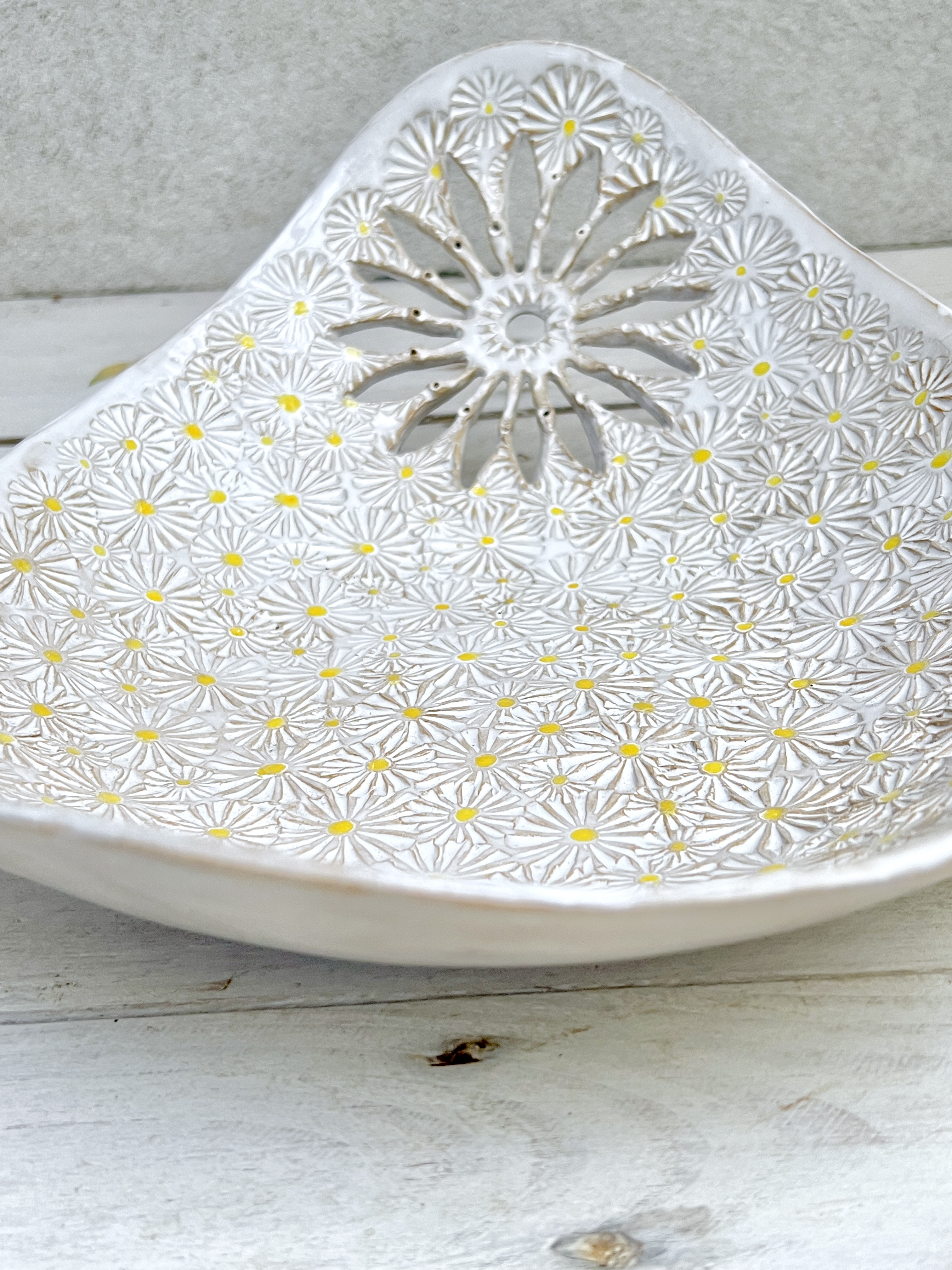 White ceramic bowl with an openwork flower