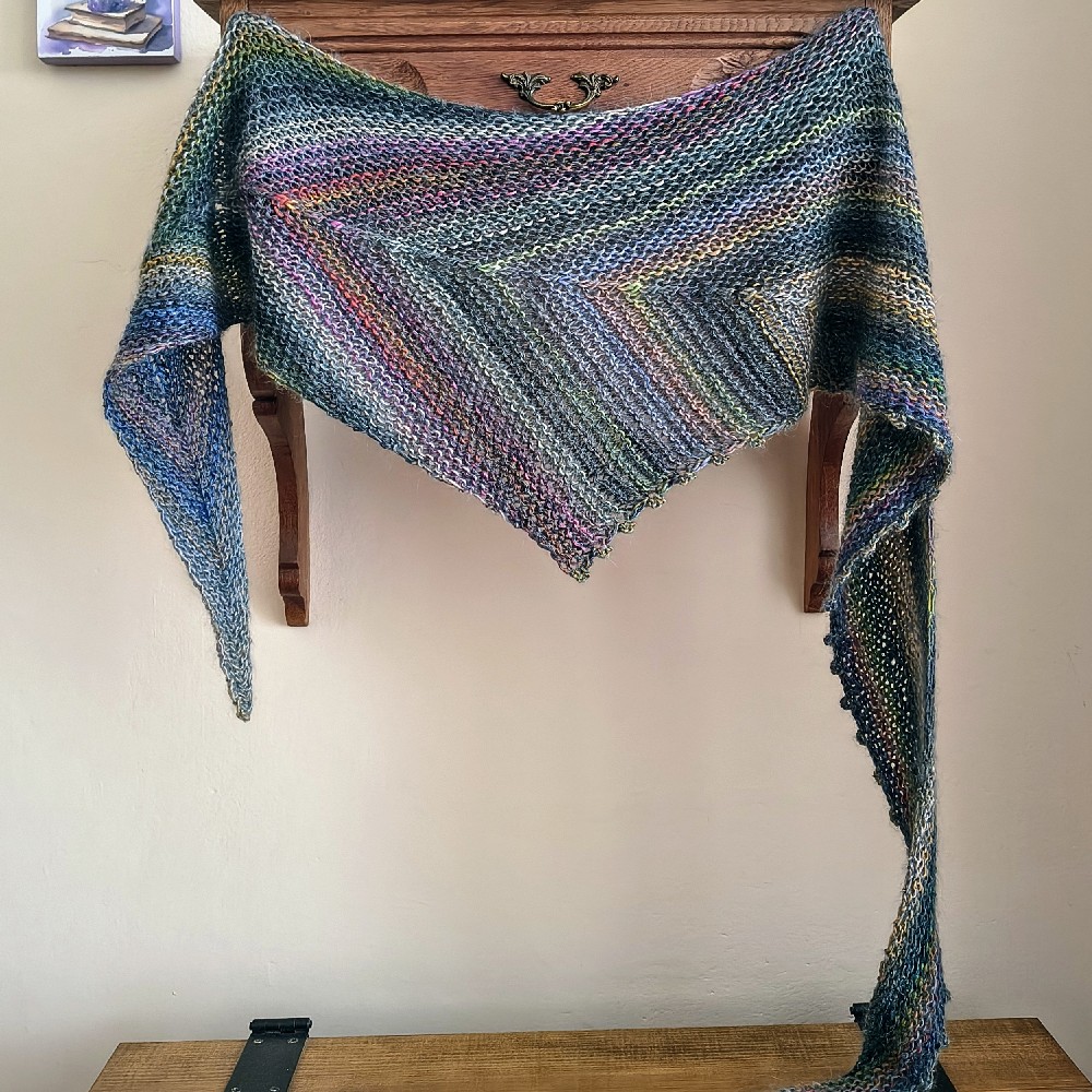 An elegant scarf/wrap made from the finest 100% merino wool blended with silk