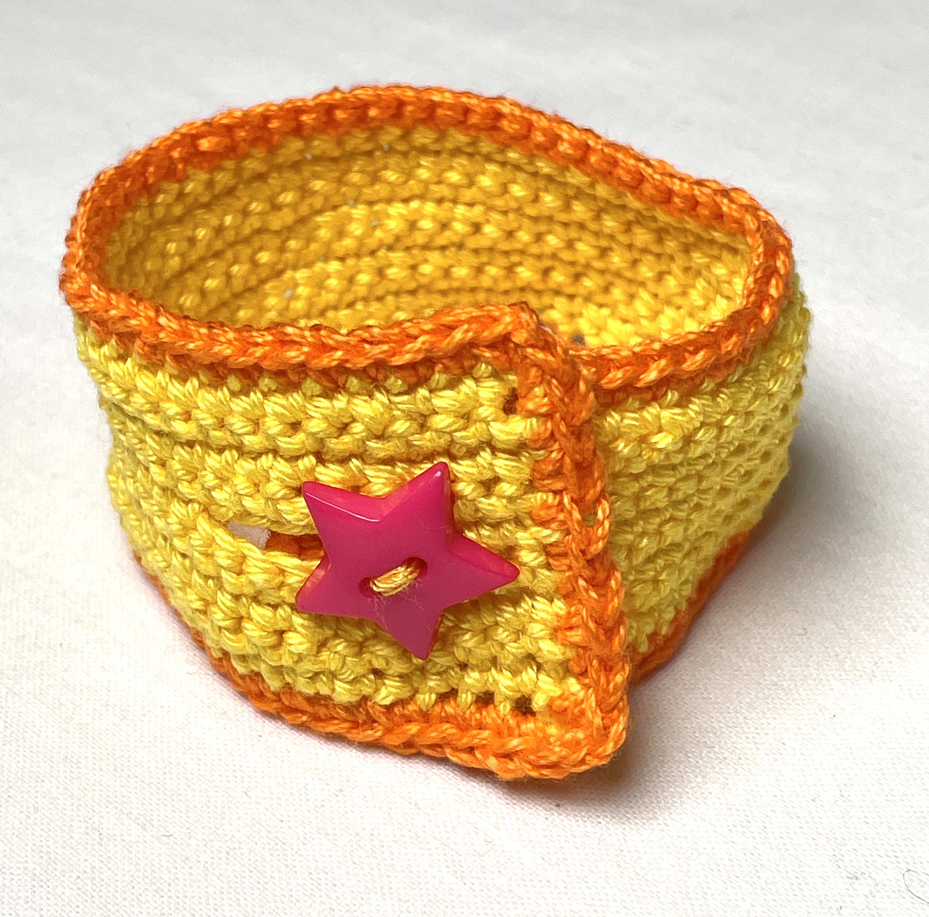Crochet wristband, yellow and orange