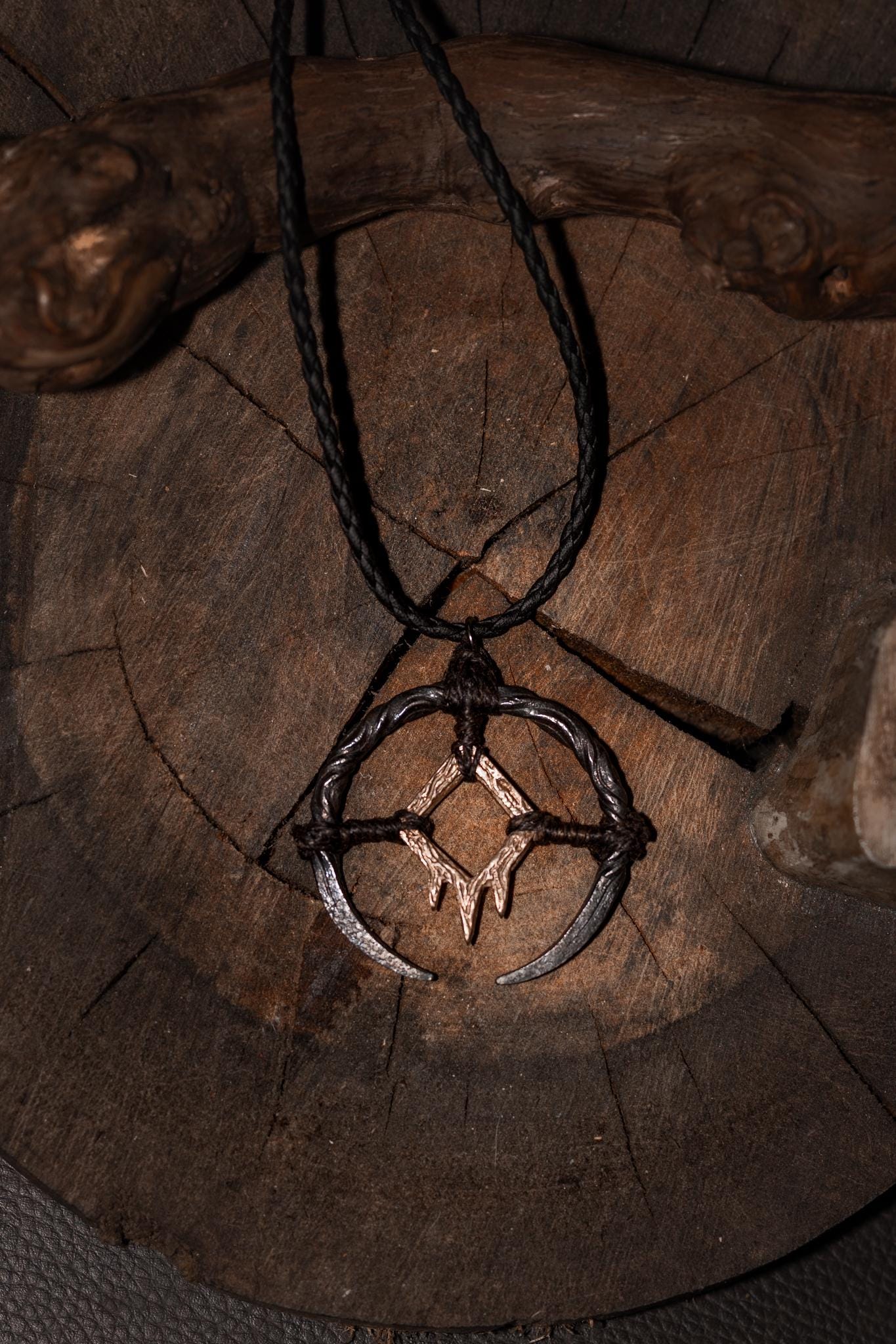 Borrowed Light Talisman, Hand-forged iron, cast bronze pendant